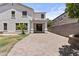 Exterior of home featuring paver driveway, desert landscaping, and white stucco at 3575 E Gary Way, Gilbert, AZ 85234
