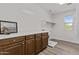Bright laundry room showcases overhead cabinets and a laundry sink at 3575 E Gary Way, Gilbert, AZ 85234