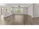Expansive living space featuring wood-look flooring, bright windows, and an open layout at 3575 E Gary Way, Gilbert, AZ 85234