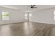 A spacious living room with wood floors and natural light from windows with blinds at 3575 E Gary Way, Gilbert, AZ 85234