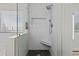 Modern bathroom featuring a shower with marble tile, a shower bench, and glass doors at 3575 E Gary Way, Gilbert, AZ 85234