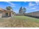 The home features a large private backyard with lush green grass, mature trees, and a covered patio at 3882 S Hawthorn Dr, Chandler, AZ 85248