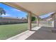 Expansive backyard features lush green grass, mature trees, and block fencing for added privacy and tranquility at 3882 S Hawthorn Dr, Chandler, AZ 85248