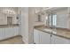 Bathroom vanity with granite counters and white cabinets at 3882 S Hawthorn Dr, Chandler, AZ 85248
