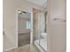 En-suite bathroom with a tile shower and view to a bedroom at 3882 S Hawthorn Dr, Chandler, AZ 85248