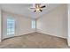 Bedroom with carpet, ceiling fan, and door to the backyard at 3882 S Hawthorn Dr, Chandler, AZ 85248