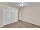 Bedroom featuring sliding closet doors and neutral carpet at 3882 S Hawthorn Dr, Chandler, AZ 85248