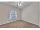 Bedroom featuring neutral carpet and shuttered window at 3882 S Hawthorn Dr, Chandler, AZ 85248