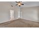 Carpeted bedroom featuring multiple doors leading to bathrooms and closets at 3882 S Hawthorn Dr, Chandler, AZ 85248