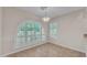 Dining room with large arched window and plantation shutters at 3882 S Hawthorn Dr, Chandler, AZ 85248
