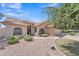 Inviting home entrance showcasing arched windows, desert landscaping, and a well-maintained walkway at 3882 S Hawthorn Dr, Chandler, AZ 85248