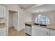 Kitchen area featuring stainless steel dishwasher and sink with window at 3882 S Hawthorn Dr, Chandler, AZ 85248