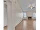 Bright living room featuring wood-look tile flooring, a fireplace, a ceiling fan, and lots of natural light at 3882 S Hawthorn Dr, Chandler, AZ 85248