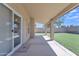 Relax on the covered patio overlooking the grassy backyard, perfect for outdoor entertaining and leisure at 3882 S Hawthorn Dr, Chandler, AZ 85248