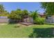 The backyard features lush greenery, a wooden pergola, and a serene outdoor setting at 428 S Sunnyvale --, Mesa, AZ 85206