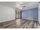 Bright bedroom with hardwood floors, ceiling fan, and a door to the backyard at 428 S Sunnyvale --, Mesa, AZ 85206