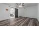 Bedroom with wood look floors and doorway access to the bathroom at 428 S Sunnyvale --, Mesa, AZ 85206