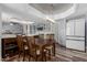 Stylish dining area featuring modern lighting, wood floors, and a decorative ceiling, perfect for Gathering meals at 428 S Sunnyvale --, Mesa, AZ 85206