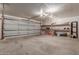Spacious garage with an insulated door, concrete floors and shelving units for storage at 428 S Sunnyvale --, Mesa, AZ 85206