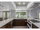 Well-lit kitchen featuring white granite countertops, stainless appliances, and view to the backyard at 428 S Sunnyvale --, Mesa, AZ 85206