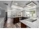 Open concept kitchen featuring stainless appliances, bar seating, and view to the backyard at 428 S Sunnyvale --, Mesa, AZ 85206
