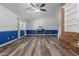 Open living room with a brick fireplace, wood-look flooring, and recessed lighting, great for entertaining and relaxing at 428 S Sunnyvale --, Mesa, AZ 85206