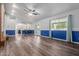 Bright living room offering a seamless flow with blue accent walls, stylish wood floors, and access to the outdoor area at 428 S Sunnyvale --, Mesa, AZ 85206