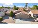Aerial view of home with a well-manicured yard and private drive at 4439 W Cielo Grande --, Glendale, AZ 85310
