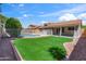 The backyard includes a pool, patio, and an artificial lawn at 4439 W Cielo Grande --, Glendale, AZ 85310