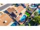 Aerial view of a backyard with a blue pool, a grass area, and an outdoor seating area at 4439 W Cielo Grande --, Glendale, AZ 85310
