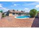 Backyard featuring a pebble ground cover and in-ground pool at 4439 W Cielo Grande --, Glendale, AZ 85310