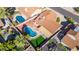 Aerial view of a backyard featuring a blue pool, small grass area, and patio with pergola at 4439 W Cielo Grande --, Glendale, AZ 85310