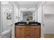 Bathroom with double sink vanity, black countertop, and modern lighting at 4439 W Cielo Grande --, Glendale, AZ 85310