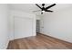 White bedroom showcasing a ceiling fan, and light wood floors at 4439 W Cielo Grande --, Glendale, AZ 85310