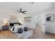 Well-lit bedroom featuring hardwood floors, ceiling fan, and neutral decor at 4439 W Cielo Grande --, Glendale, AZ 85310