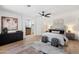 Spacious bedroom with ensuite bathroom, ceiling fan, and hardwood floors at 4439 W Cielo Grande --, Glendale, AZ 85310