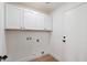 Clean laundry room with ample cabinets and storage space at 4439 W Cielo Grande --, Glendale, AZ 85310