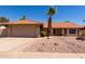 Charming single-story home featuring a well-manicured yard, a two-car garage, and a classic Southwestern design at 5354 E Ellis St, Mesa, AZ 85205