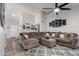 Comfortable living room with large sectional sofa, stylish rug, and lots of natural light at 5354 E Ellis St, Mesa, AZ 85205