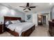 Relaxing main bedroom showcasing a king-size bed, neutral walls, and a ceiling fan for added comfort at 5354 E Ellis St, Mesa, AZ 85205