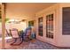 Covered patio with outdoor seating provides a cozy space for relaxation and entertaining at 5354 E Ellis St, Mesa, AZ 85205