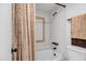 Cozy bathroom features a shower-tub combination with decorative tile and neutral-toned shower curtain at 7557 N Dreamy Draw Dr # 154, Phoenix, AZ 85020