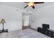 Bedroom featuring a ceiling fan and dark wood furniture, offering plenty of closet space at 7557 N Dreamy Draw Dr # 154, Phoenix, AZ 85020