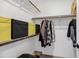 Organized closet with shelving, hanging rods, storage bins and room for suitcases for efficient storage at 7557 N Dreamy Draw Dr # 154, Phoenix, AZ 85020