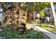 Close up view of the community fountain surrounded by lush green plants and a walkway to the condominiums at 7557 N Dreamy Draw Dr # 154, Phoenix, AZ 85020