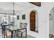 Dining area featuring a glass table with seating for six, with a mirror and an arched entryway at 7557 N Dreamy Draw Dr # 154, Phoenix, AZ 85020
