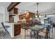 Well-designed kitchen with warm wood cabinets, stainless steel appliances, and dining table at 7557 N Dreamy Draw Dr # 154, Phoenix, AZ 85020