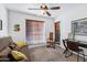 Inviting living room with sofa, desk, ceiling fan, window coverings and access to the outdoors at 7557 N Dreamy Draw Dr # 154, Phoenix, AZ 85020