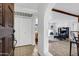 An interior view showing the arched entryway leading to the living room with tile floors and neutral paint at 7557 N Dreamy Draw Dr # 154, Phoenix, AZ 85020