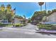 Community entrance featuring 'The Pointe Condominiums' sign, lush landscaping, and mountain views at 7557 N Dreamy Draw Dr # 154, Phoenix, AZ 85020
